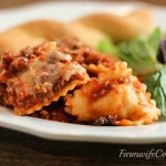 Are you looking for a new crock pot recipe that will be a big hit with the family? This Slow Cooker Cheesy Ravioli Casserole is a family favorite!