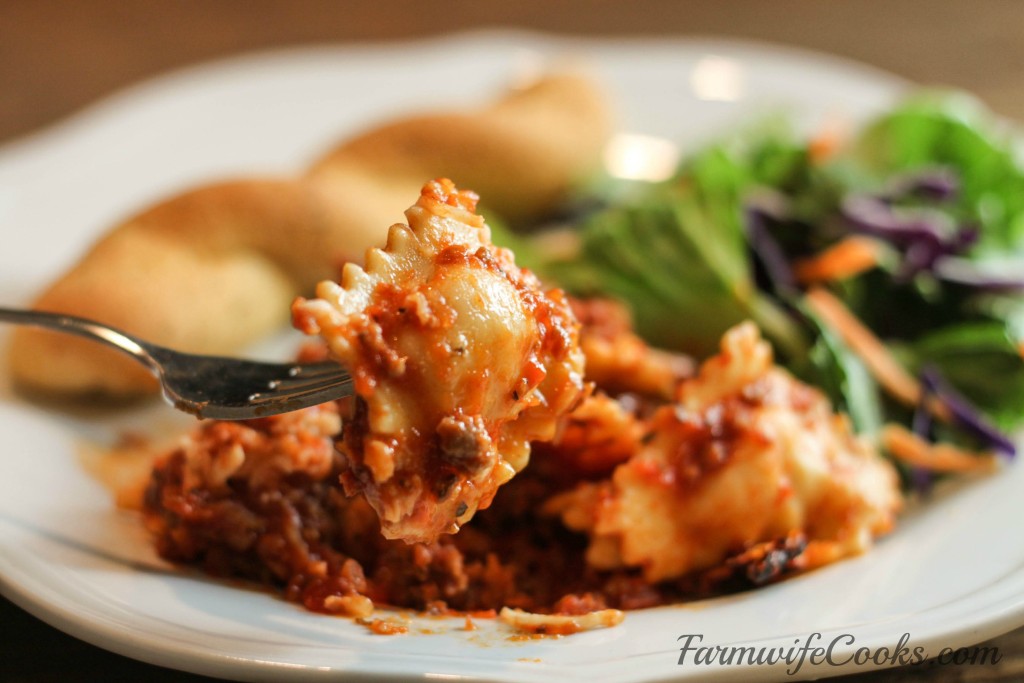 Are you looking for a new crock pot recipe that will be a big hit with the family? This Slow Cooker Cheesy Ravioli Casserole is a family favorite!