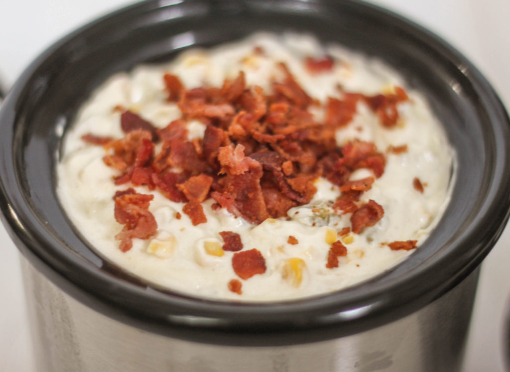 Great slow cooker dip recipe with corn and bacon! Great for tailgating or while watching the big game!