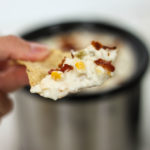 Great crock pot dip recipe with corn and bacon! Perfect for tailgating or to make while watching the big game.