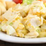 This Hot Chicken Salad recipe is topped with potato chips and is a casserole the whole family will love!