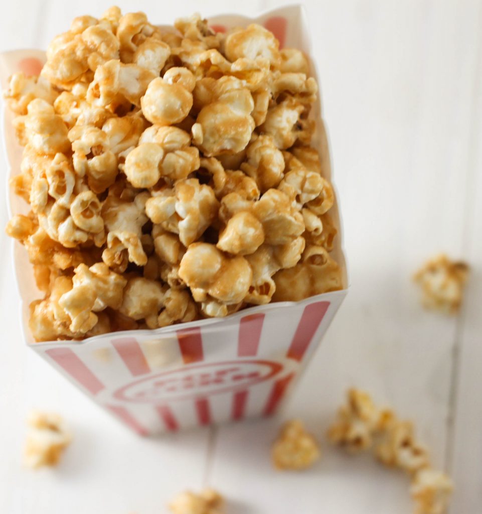 Are you looking for an easy Homemade Caramel Corn recipe? This recipe is so good and makes a great popcorn snack or holiday treat!