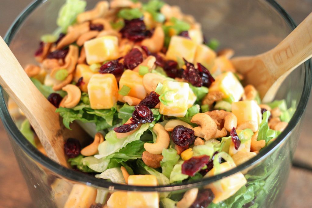This Cranberry Lettuce Salad is the perfect salad for your family Thanksgiving or Christmas but easy enough for a weeknight meal. This recipe is the perfect healthy side recipes for a holiday pitch-in. 