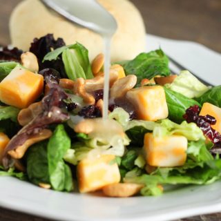 This Cranberry Lettuce Salad is the perfect salad for your family Thanksgiving or Christmas but easy enough for a weeknight meal. This recipe is the perfect healthy side recipes for a holiday pitch-in.