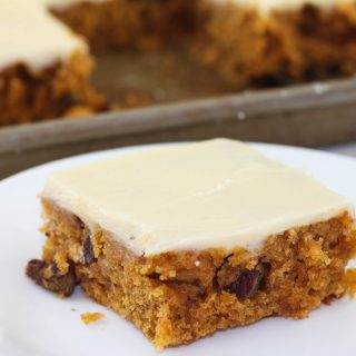 This Pumpkin Sheet Cake is an easy homemade sheet cake that bakes in less than 30 minutes. The cake is topped with cream cheese icing for the perfect fall dessert.