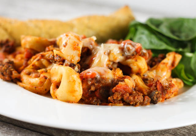 This Cheesy Crock Pot Tortellini Casserole recipe is quick and easy to make and kid approved!