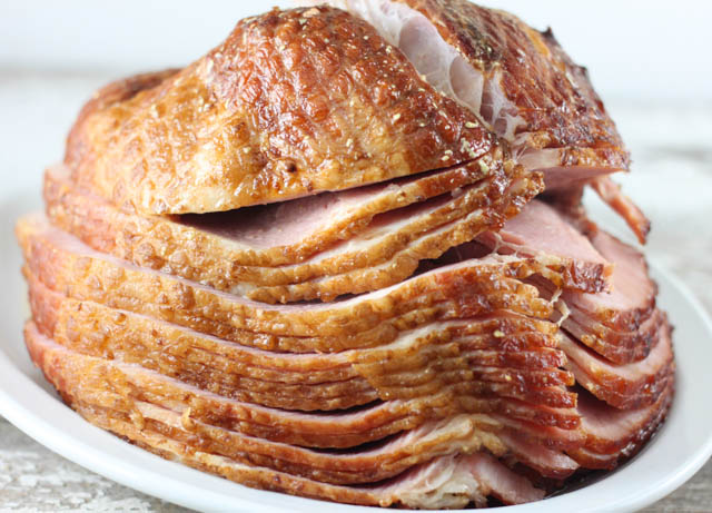 Are you looking for a simple ham recipe that can be made in the crock pot? This Slow Cooker Honey Dijon Ham is the perfect ham recipe for the holidays or family dinner.