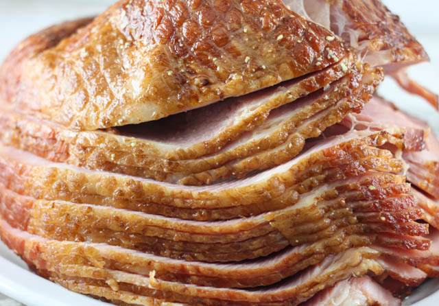 Are you looking for a simple ham recipe that can be made in the crock pot? This Slow Cooker Honey Dijon Ham is the perfect ham recipe for the holidays or family dinner.