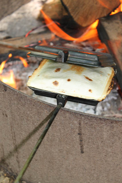 Are you looking for a new, easy, make ahead recipe to make during your next camping trip? This Pie Iron Tasty Taco recipe is great over the campfire.
