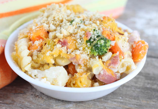 This Cheesy Ham & Vegetable Bake is a quick and easy casserole recipe packed with pasta, ham, broccoli, carrots and cauliflower in a cheesy cream sauce.