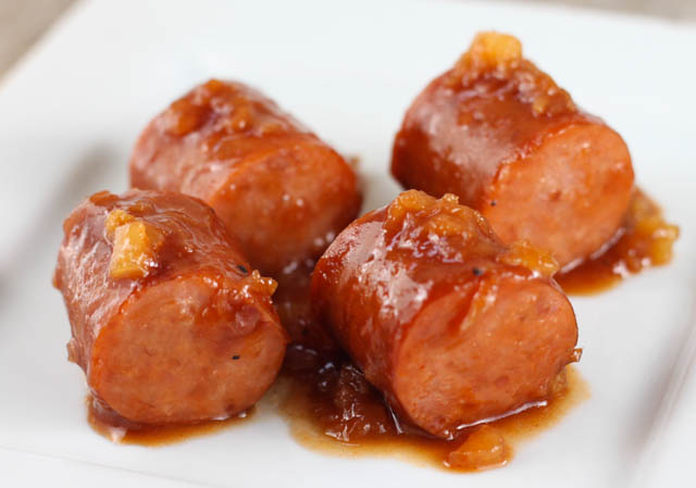 Slow cooker Hawaiian Kielbasa Bites are the perfect appetizer for game day or holiday potluck. An easy recipe made with Kielbasa sausage, pineapple, BBQ sauce, brown sugar and spices.