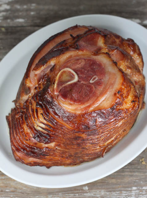 This Slow Cooker Holiday Brown Sugar Ham has all your favorite traditional flavors including pineapple and maple syrup and will be a hit at your next Holiday!