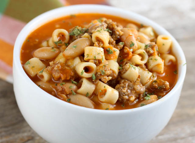 Mommy's Pasta Fagioli is a pasta and bean soup that includes sausage and is hearty enough to be served as an easy meal.