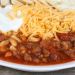 This Easy Chili Mac is a one pot meal that the whole family will love, that is made with ground beef, chili beans, macaroni and topped with cheese!