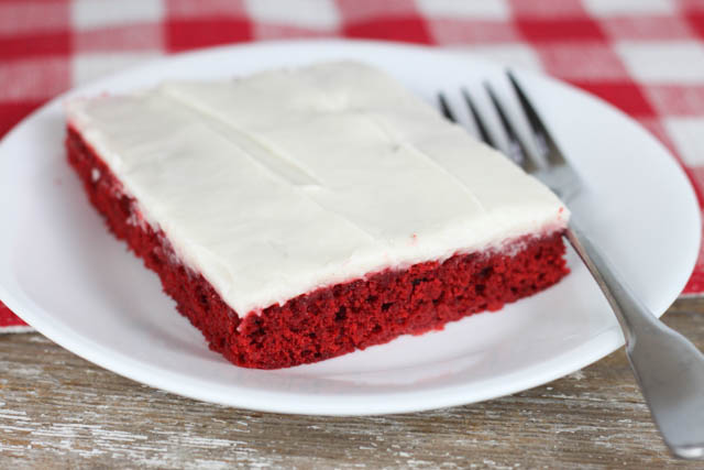 Red Velvet Texas Sheet Cake with cream cheese frosting has your favorite red velvet flavor, can be made in a hurry and will feed a crowd!