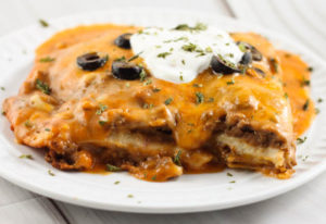 Crock Pot Ground Beef Enchilada Casserole is an easy layered Mexican dish the whole family will love!