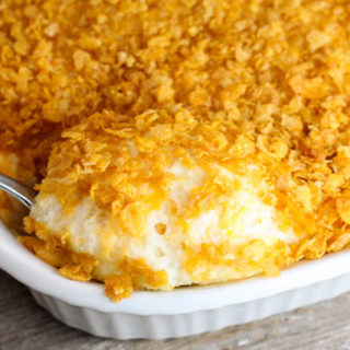 Cheese Potato Casserole is a family favorite at our house! A yummy potato side dish that is topped with cornflakes.