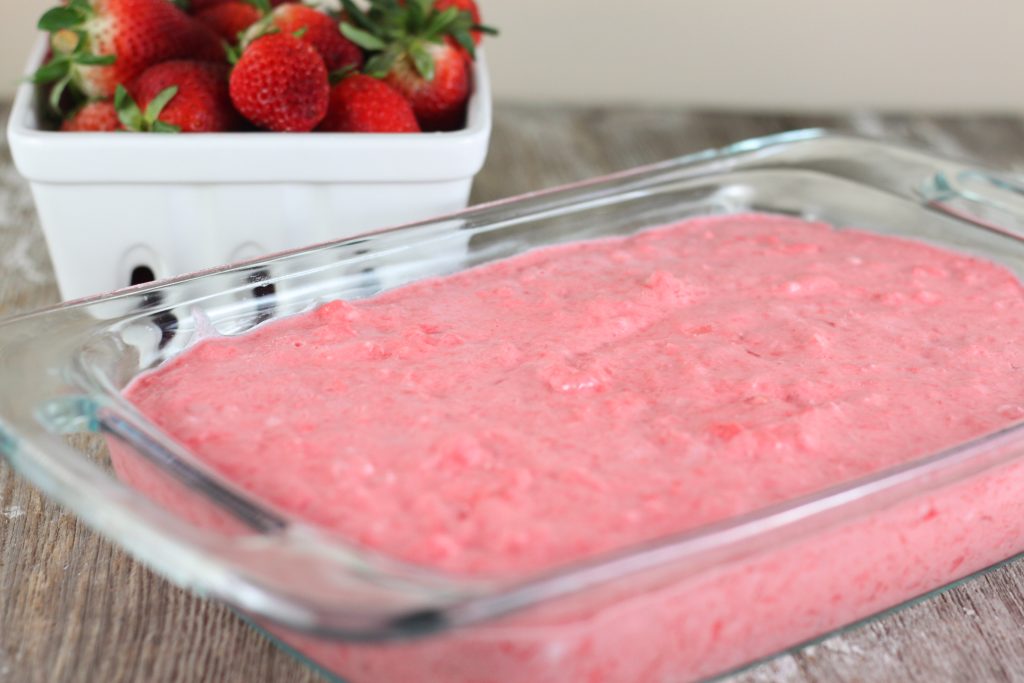 Strawberry Jello Fluff Salad is a classic mid-western holiday dish that includes strawberry jello, cream cheese, marshmallows, crushed pineapple and dream whip. This recipe is made without cottage cheese.