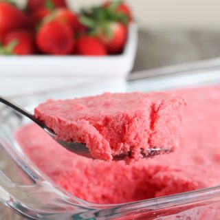Strawberry Jello Fluff Salad is a classic mid-western holiday dish that includes strawberry jello, cream cheese, marshmallows, crushed pineapple and dream whip. This recipe is made without cottage cheese.